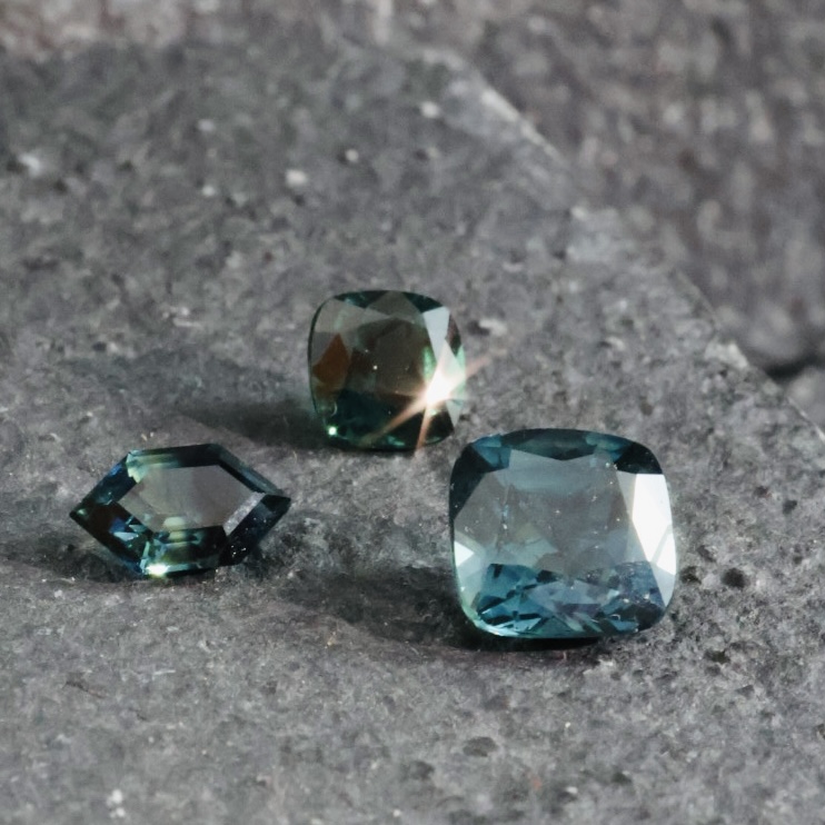 Journal Entry March 2026 - From loose gemstones to sapphire rings. Memories of a saltwater lake made into a wearable piece charged with meaning and intent. 2 These sapphires were the starting point. Their shape and colour told me how to make these rings - from the bezel to the engraving, to the diamonds at north and
south.